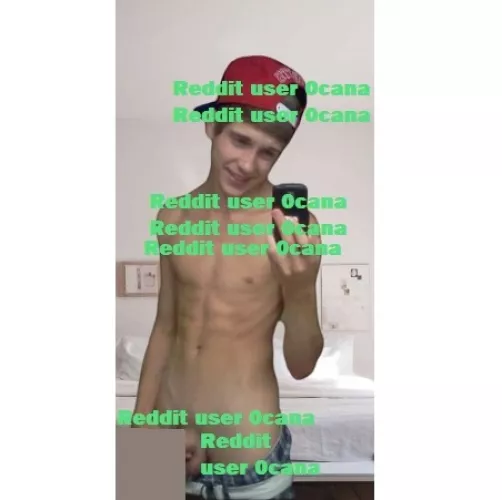 18, American. Wearing red hat, blue checkered boxers, and white belt.