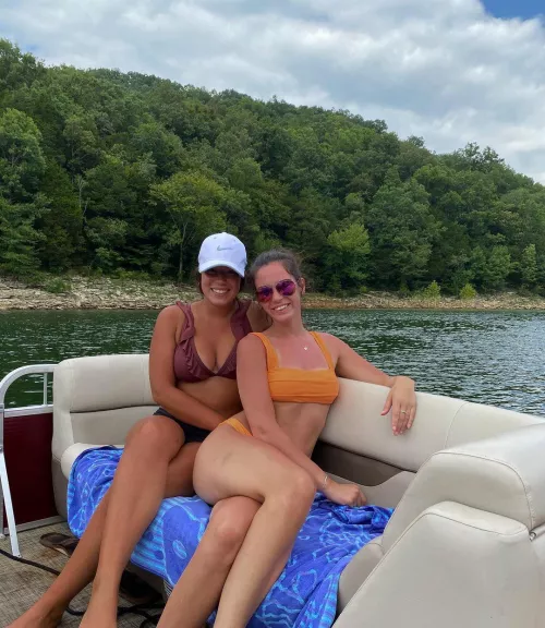 [2] On a boat by the river