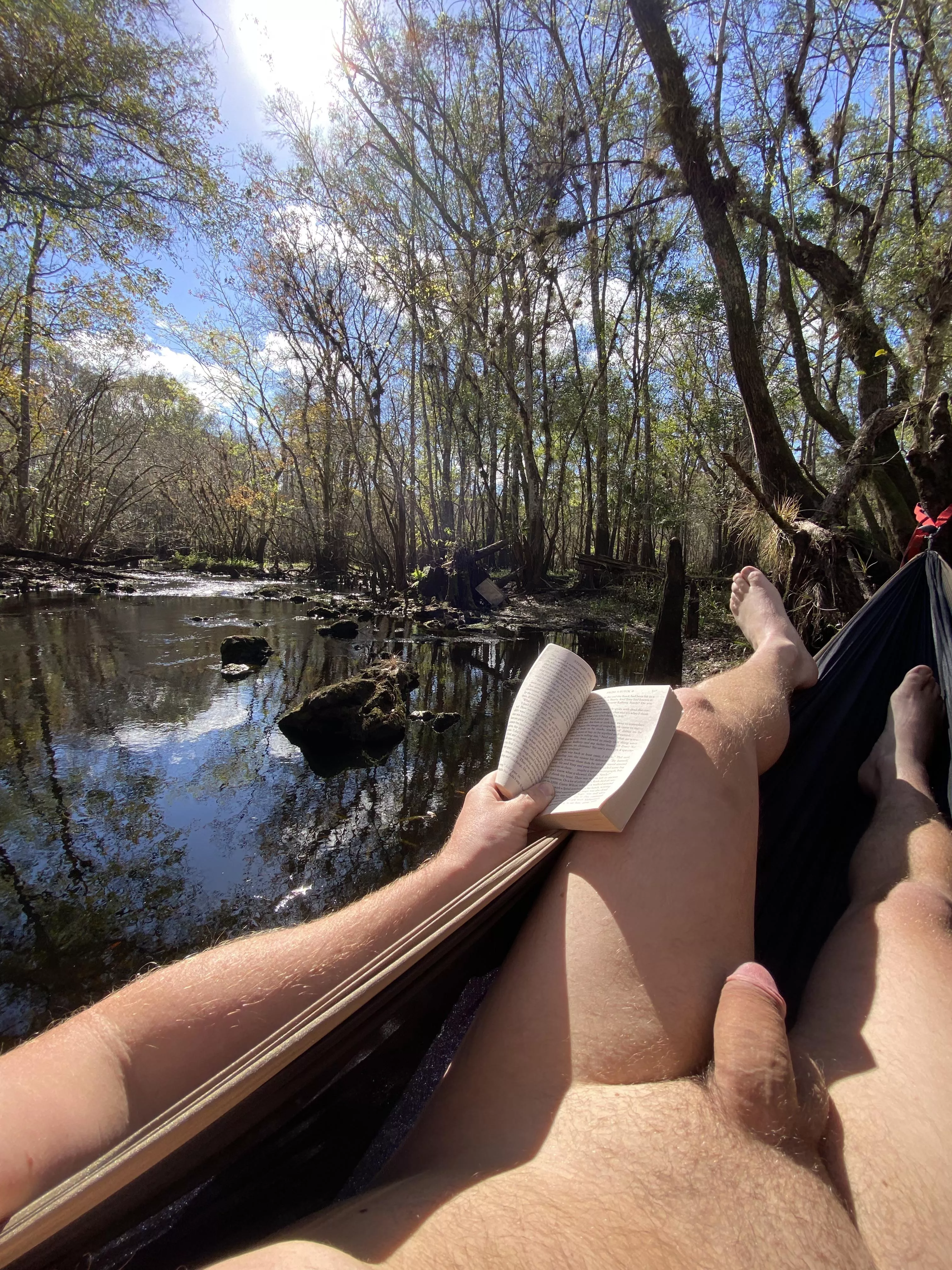 A babbling spring, shining sun, good book and no clothes