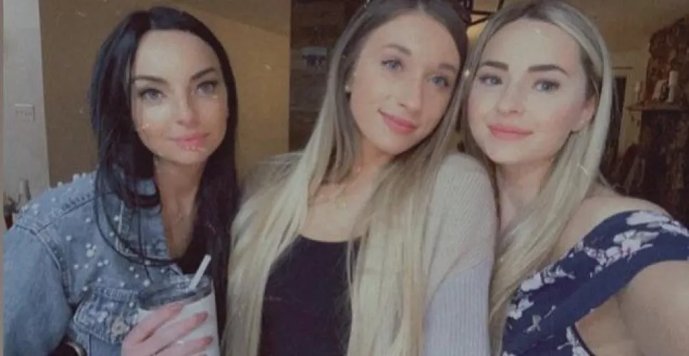 A brunette and 2 blondes