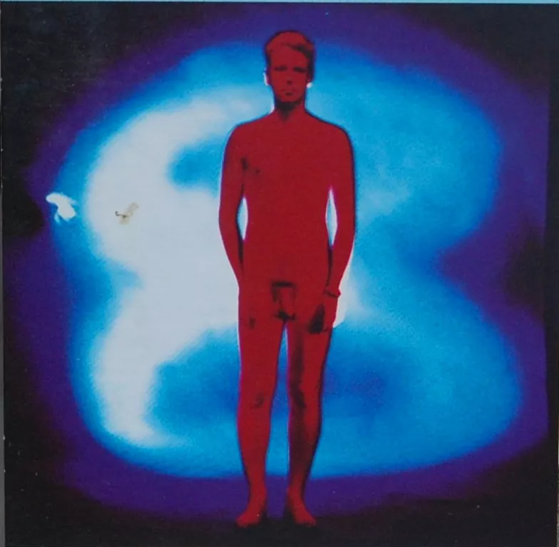 Adam Clayton, bassist with U2, naked on the cover of the 1991 album Achtung Baby.