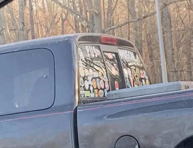 Alright, which one of you owns this PUS WAGON truck? (Text near the top of the windows)