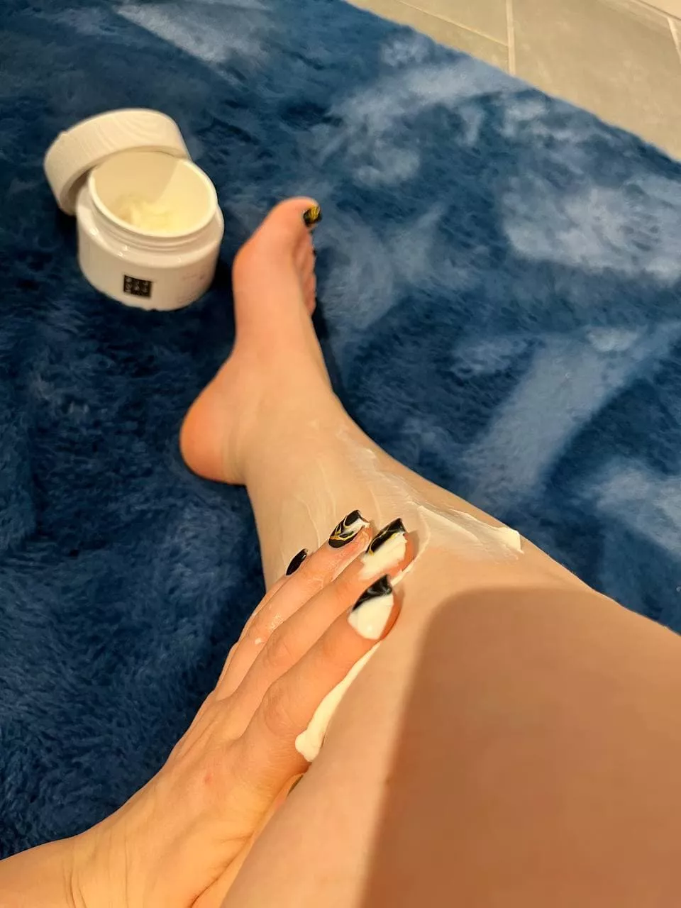 Apply cream to my leg and feet to keep my skin nice and soft.