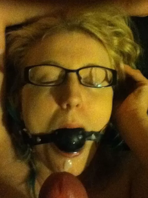 ballgagged blonde cutie takes a load