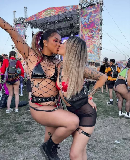 Beautiful Girls kissing in festival