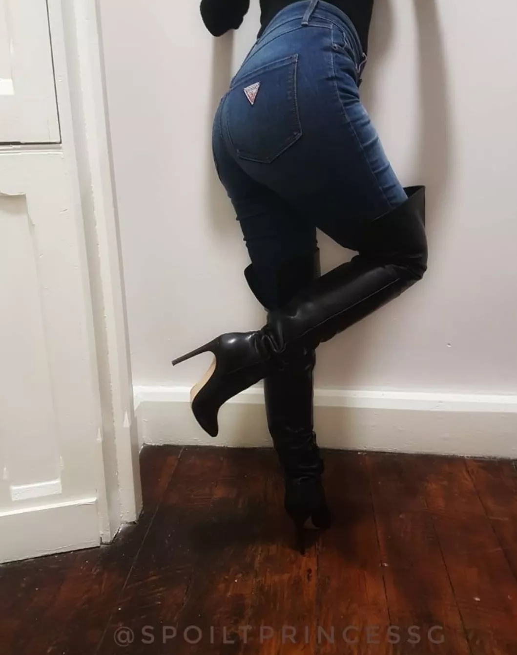 Black leather boots with blue jeans. Black leather boots with blue jeans.
