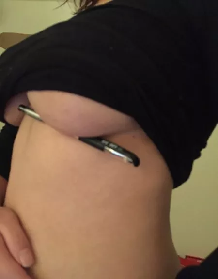 Black top underboob holding pen