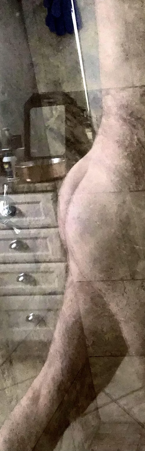 Bubble reflecting in shower glass