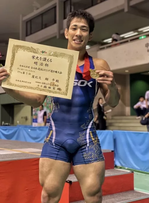 Bulging Abs through singlet, tree trunk legs