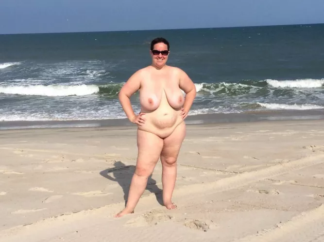 Busty nudist posing on the beach (1 more in comments)