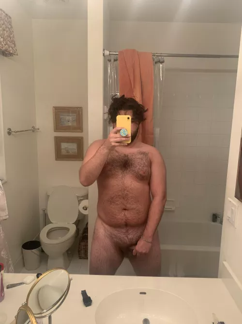 Checking out my tan progress after a day by the pool