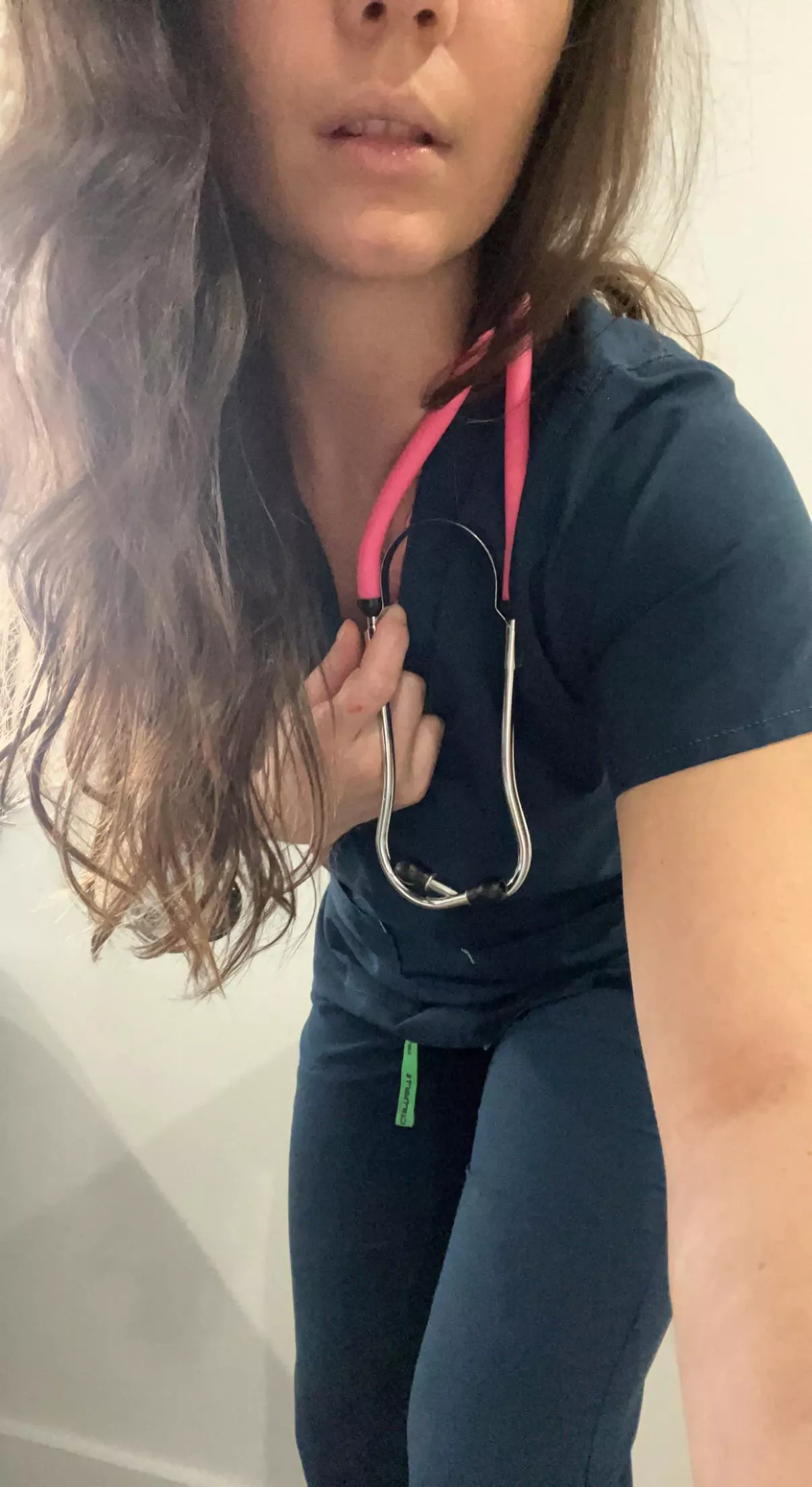 Come watch me take my scrubs off