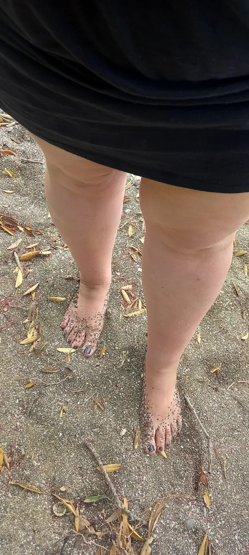 Dirty beach feet.
