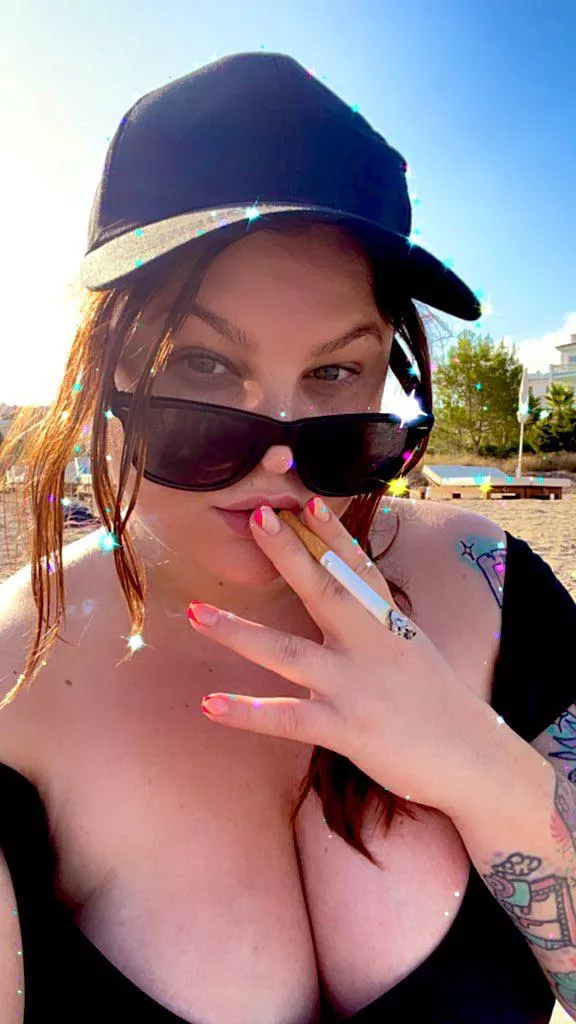 Enjoying a cigarette on the beach Enjoying a cigarette on the beach