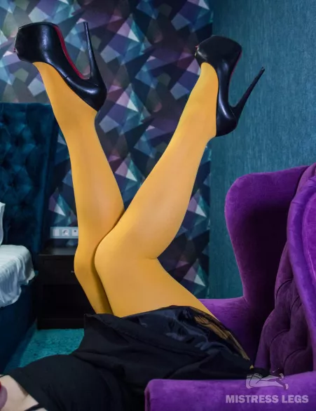 Gorgeous legs in yellow pantyhose and high heels