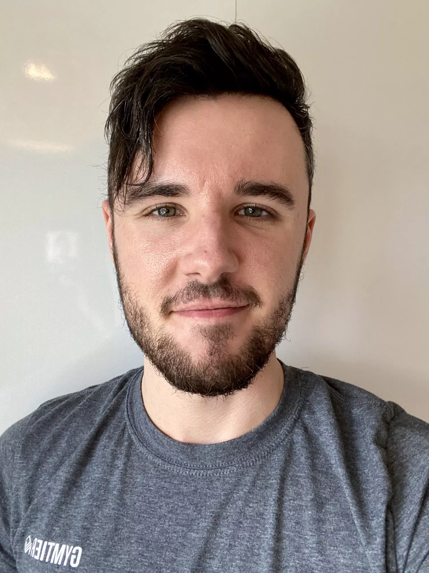 Got told my work photo looked like a prison mugshot. What do you guys think? Got told my work photo looked like a prison mugshot. What do you guys think?