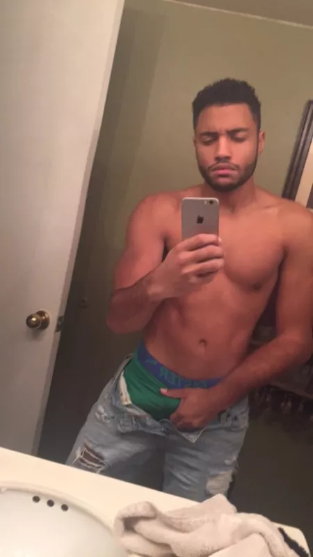 Grabbing his hard dick