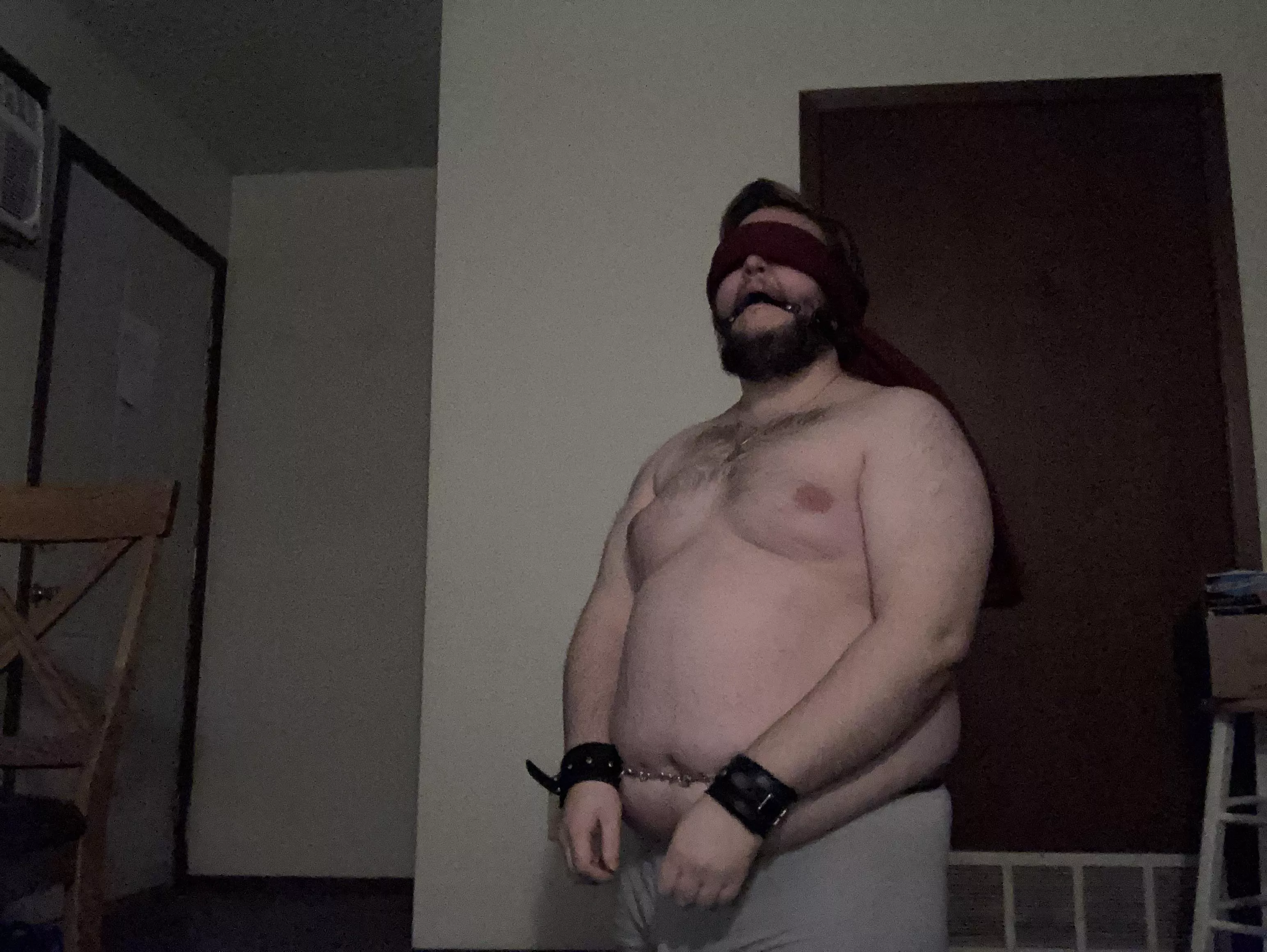Handcuffed, ball gagged, and blindfolded
