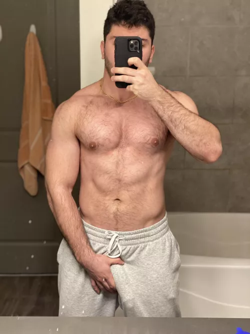 I love letting my huge cock swing around in my grey sweatpants.