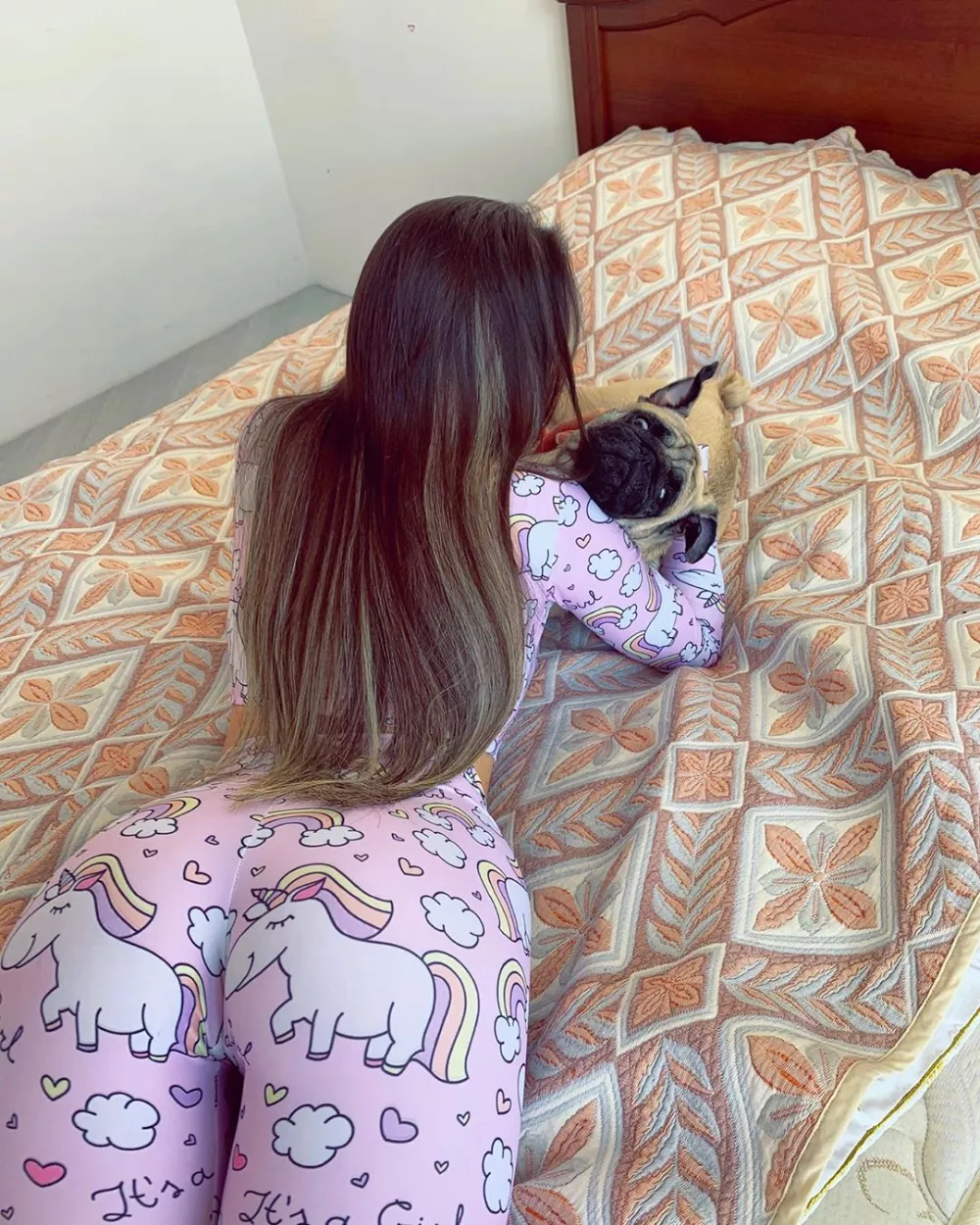 Just a girl in pyjamas playing with a pug Just a girl in pyjamas playing with a pug