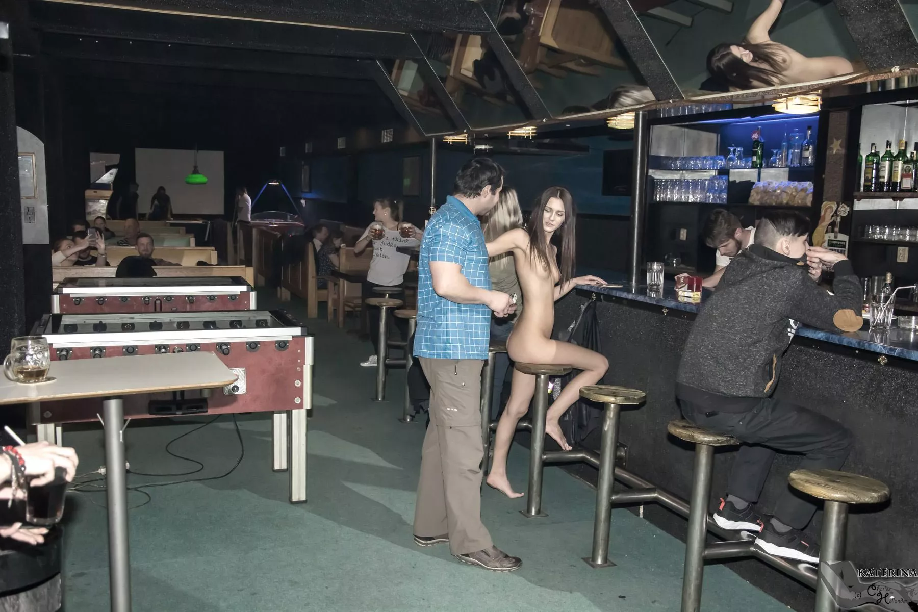 Katerina having a drink. Naked.