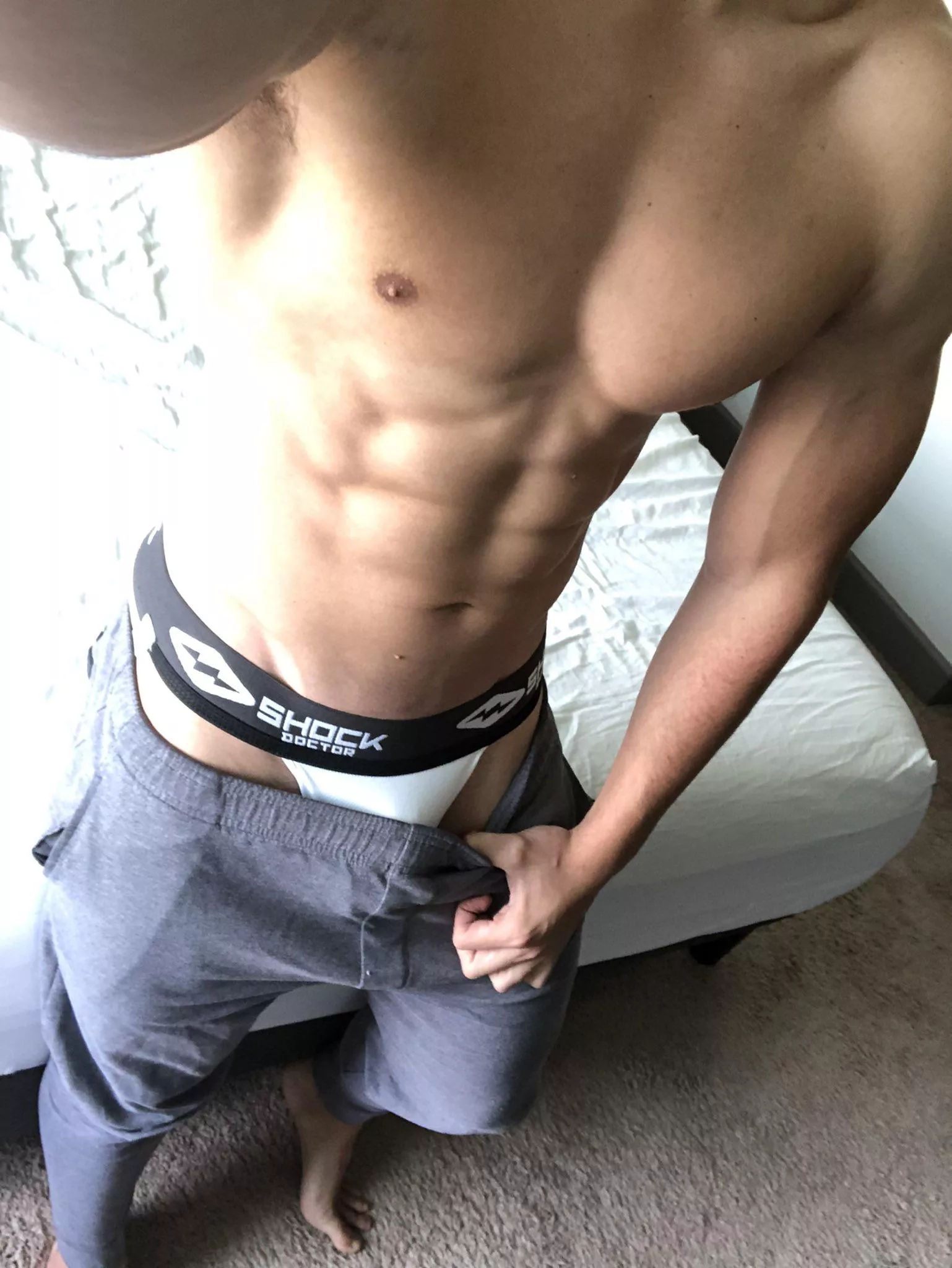 Liking the grey sweatpants and jockstrap combo lately