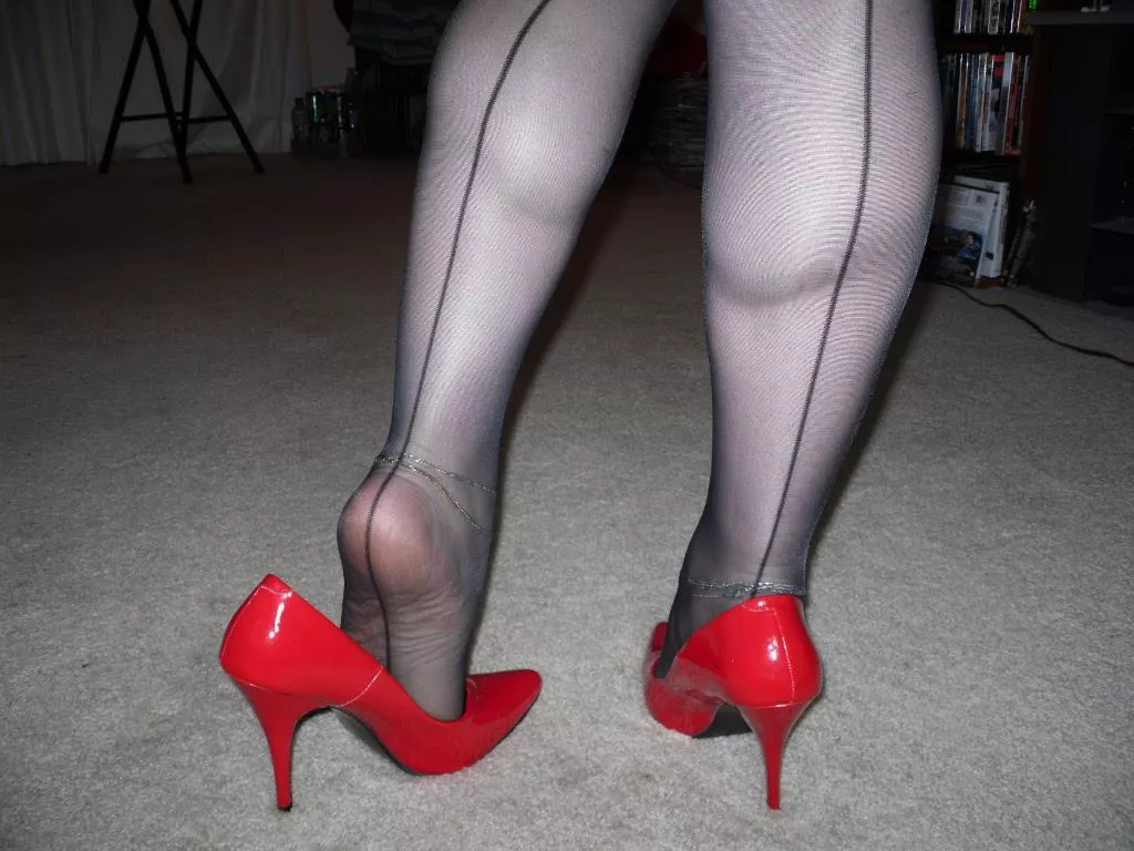 My stocking feet in classic red pumps