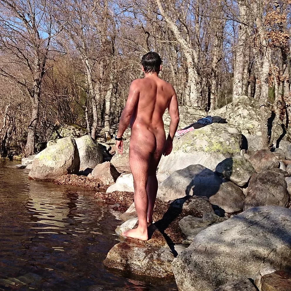 Naked body in the lake. Winter nudism