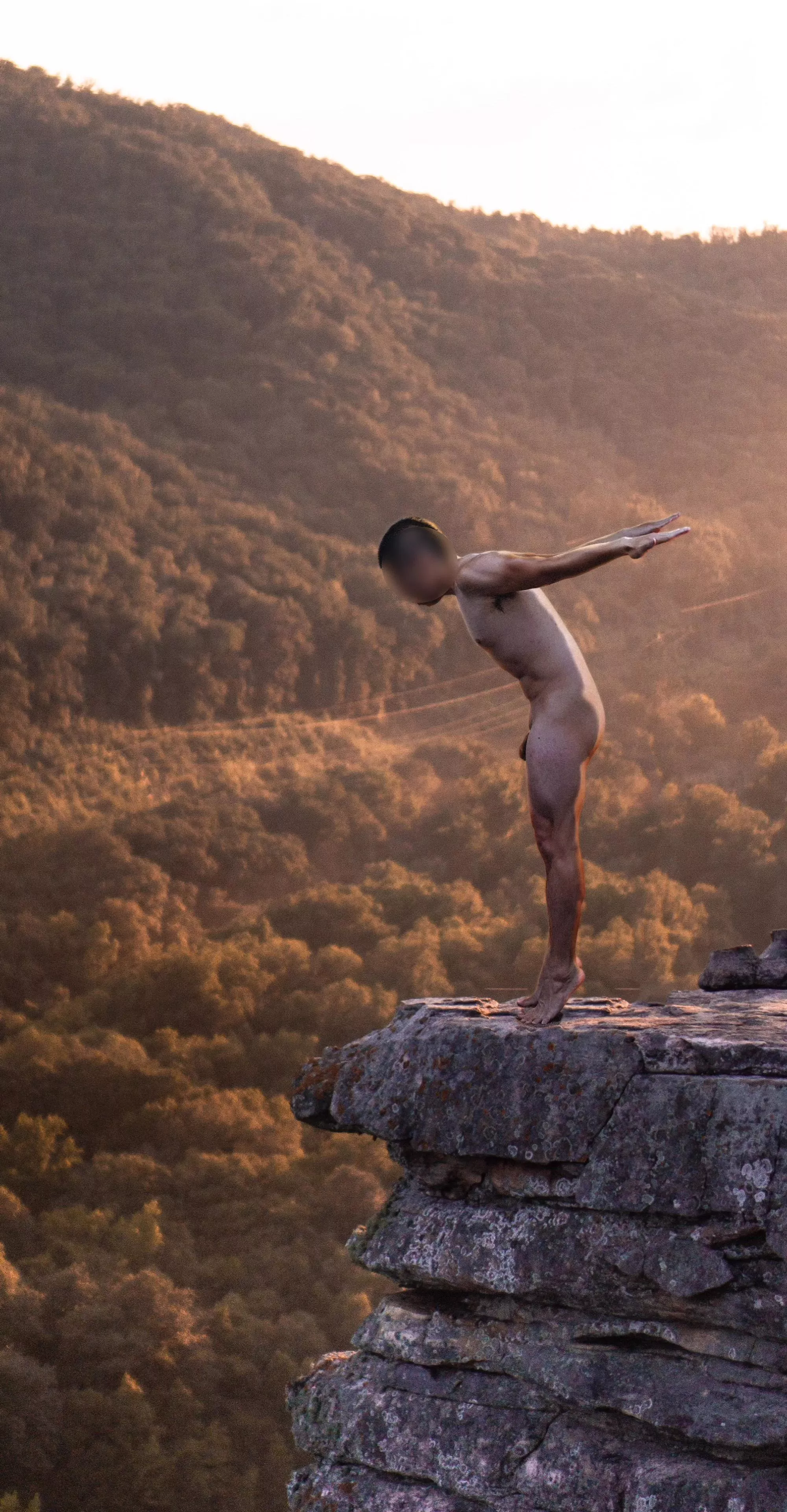 Naked on the cliffside. How thrilling!