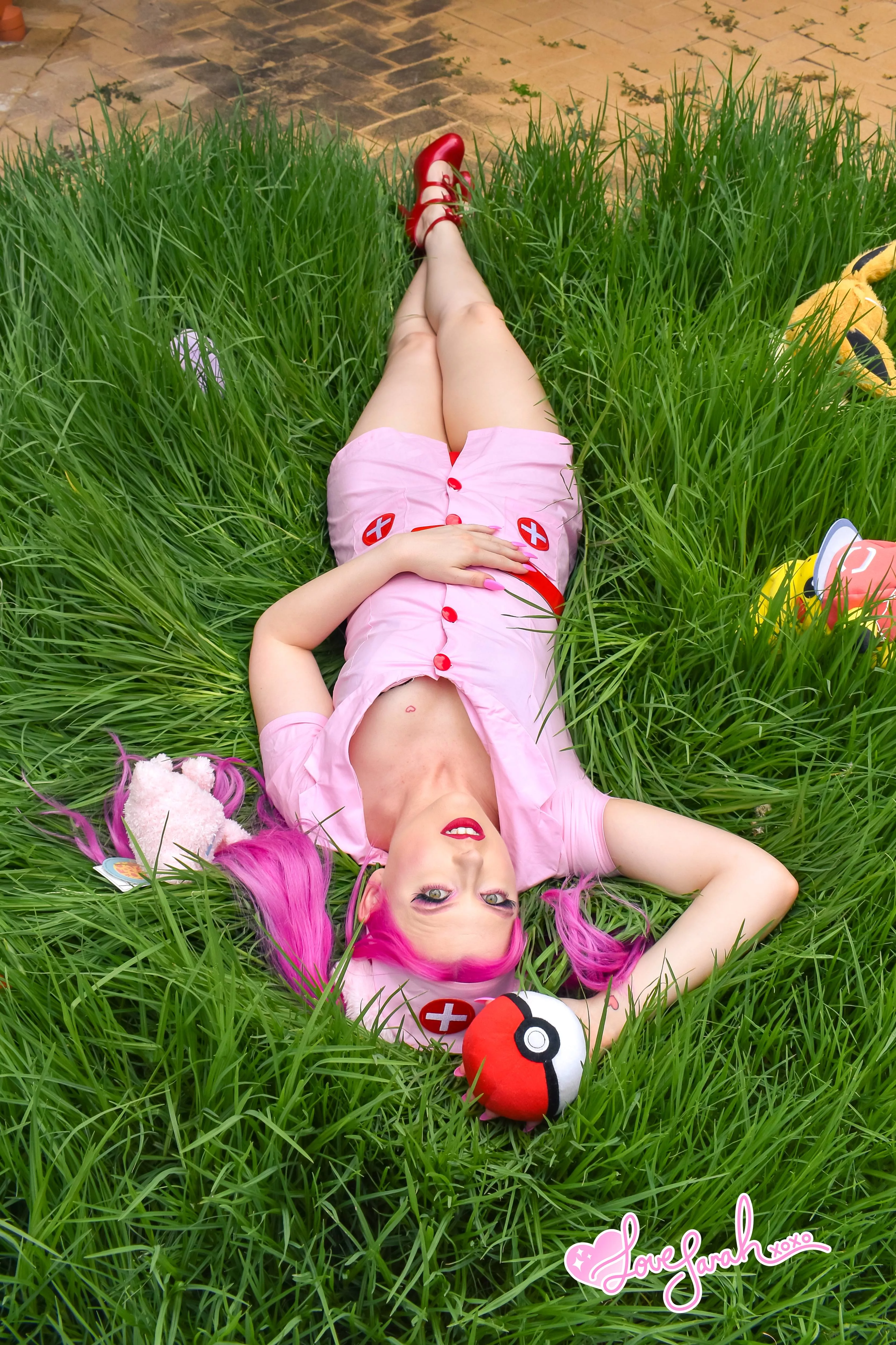 Nurse joy taking a nap in the long grass. Would you let her handle your pokeBALLS?
