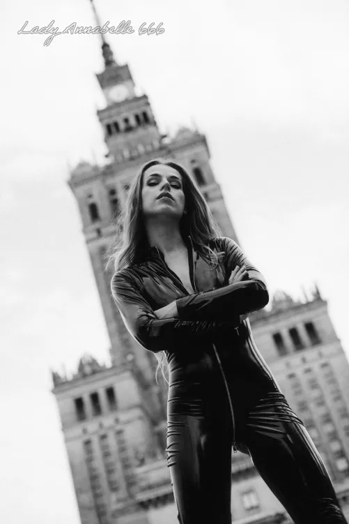 Outside in shiny outfit.