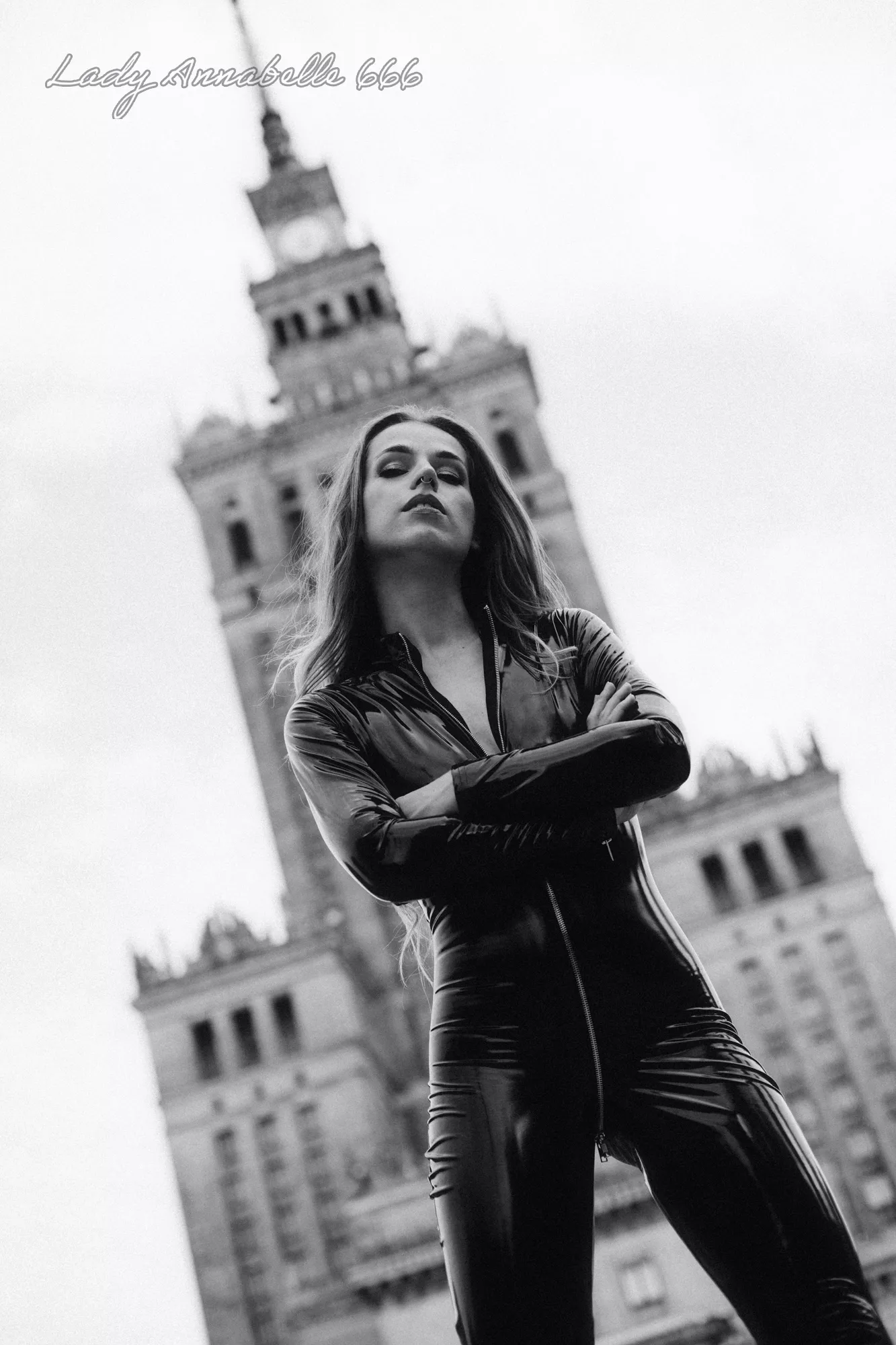 Outside in shiny outfit.