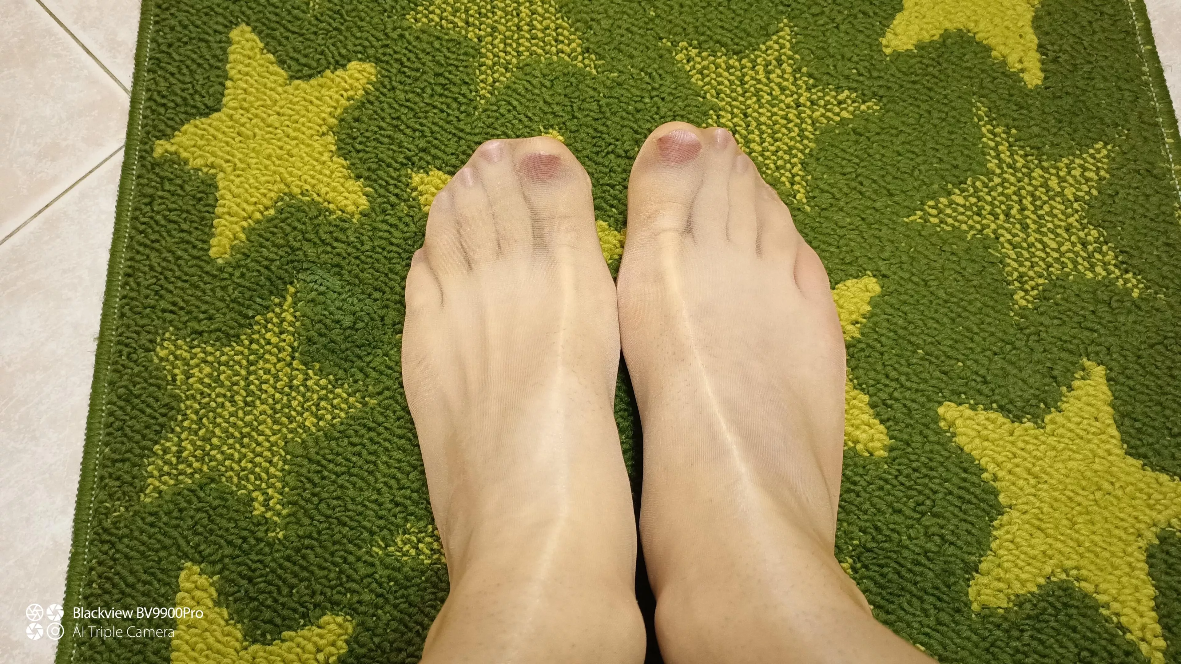 Painted nails and glossy pantyhose