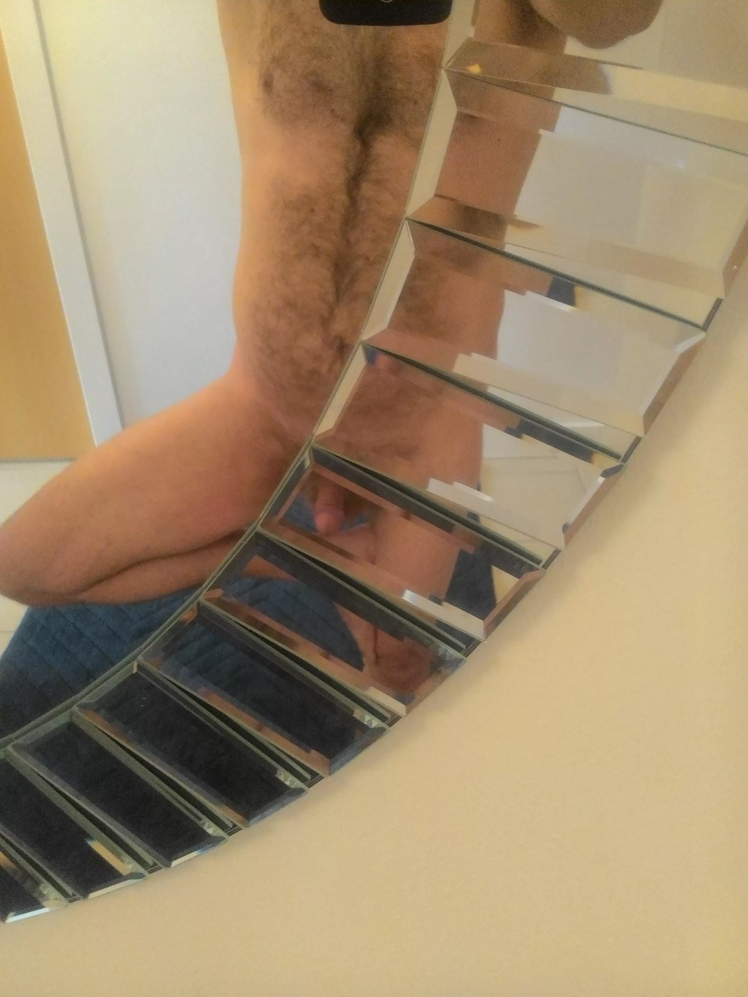 Practicing Tree Pose in a Miror Practicing Tree Pose in a Miror