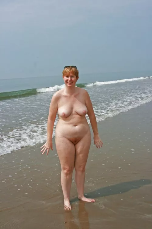 Proving she's a natural redhead at the beach