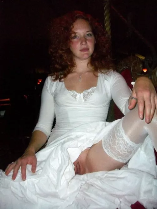 Redhead bride giving us a peek