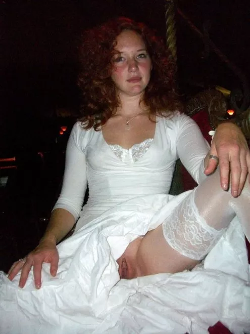 Redhead bride giving us a peek