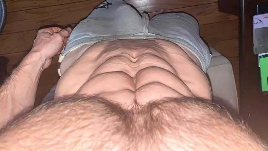 Ripped abs and grey shorts