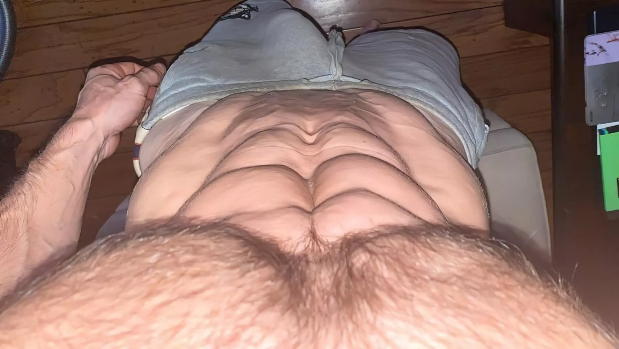 Ripped abs and grey shorts