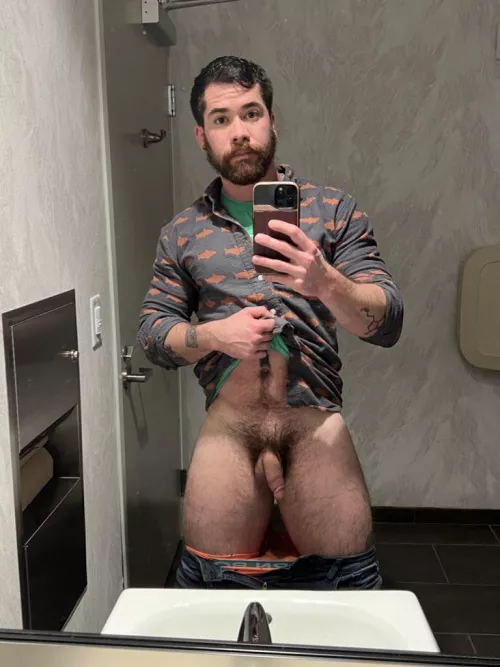 Risky public bathroom selfie