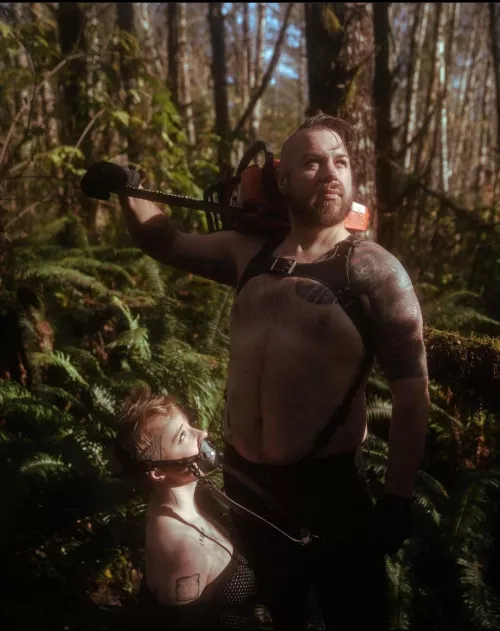 Roughing it in the mountains rocking a leather bulldog harness and a muzzled sub