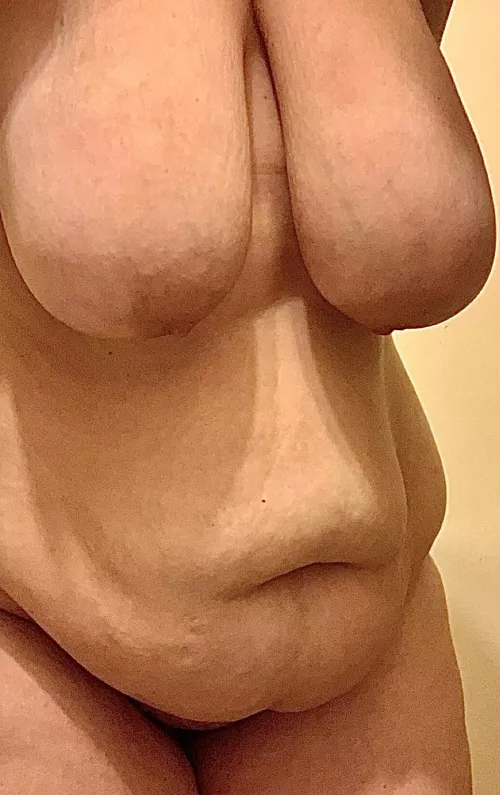 Saggy tits dangling on a big hanging belly