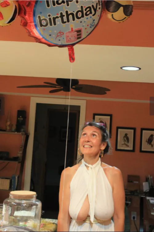 She looks at the balloon above, but the others look at another balloon...