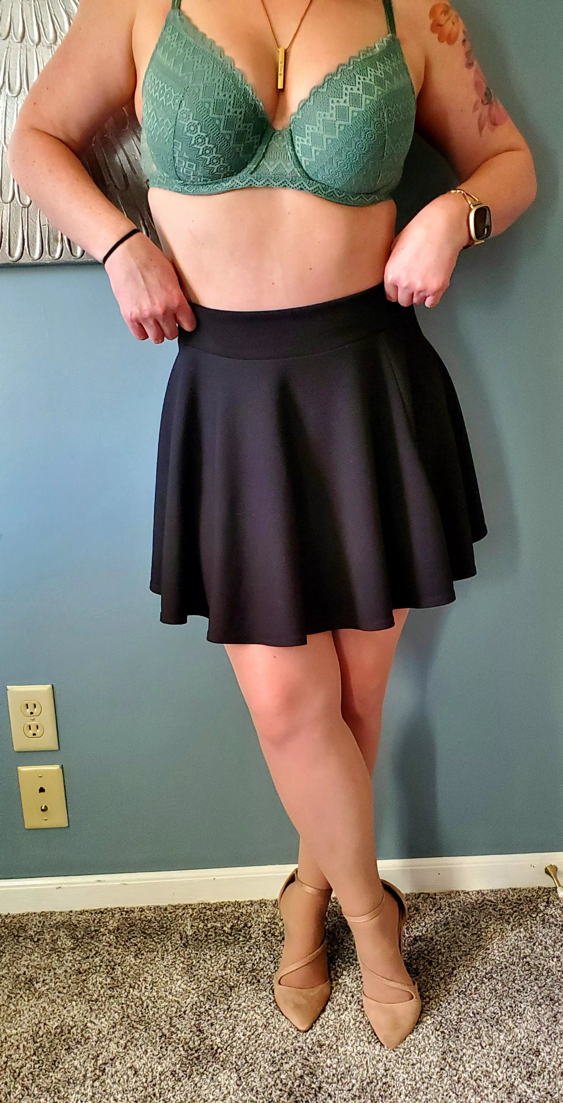 Skirt, pantyhose, and heels stay on.
