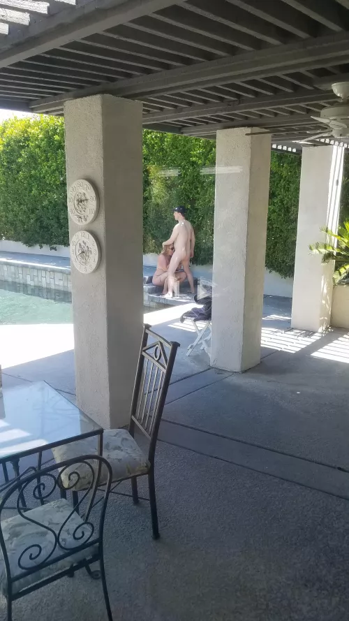 Sucking off our host like a good girl, while my husband takes pictures from his living room.