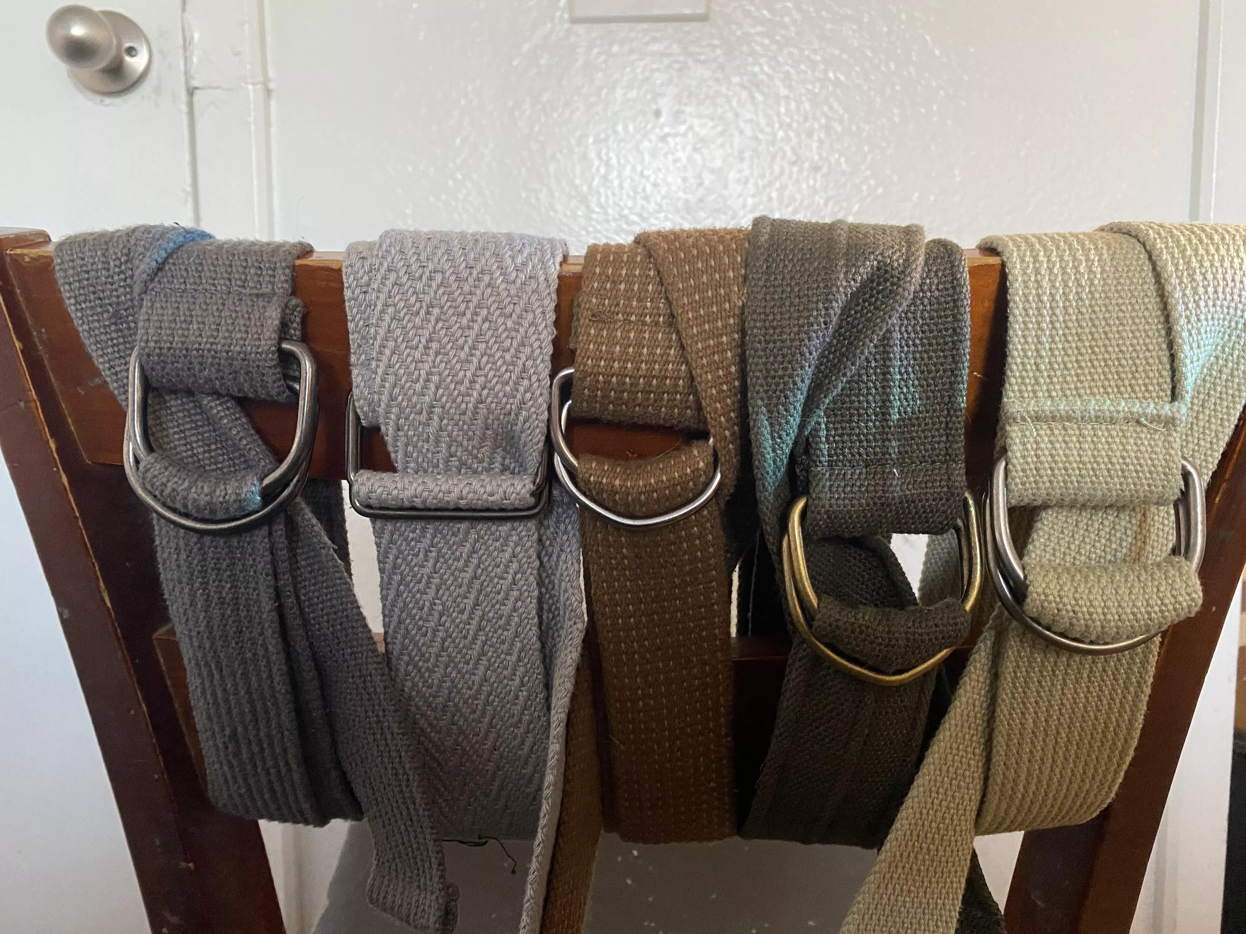 This Riggers Style Belt is definitely the type you should look for. Bonus when not in use it pads the wooden chair very well.