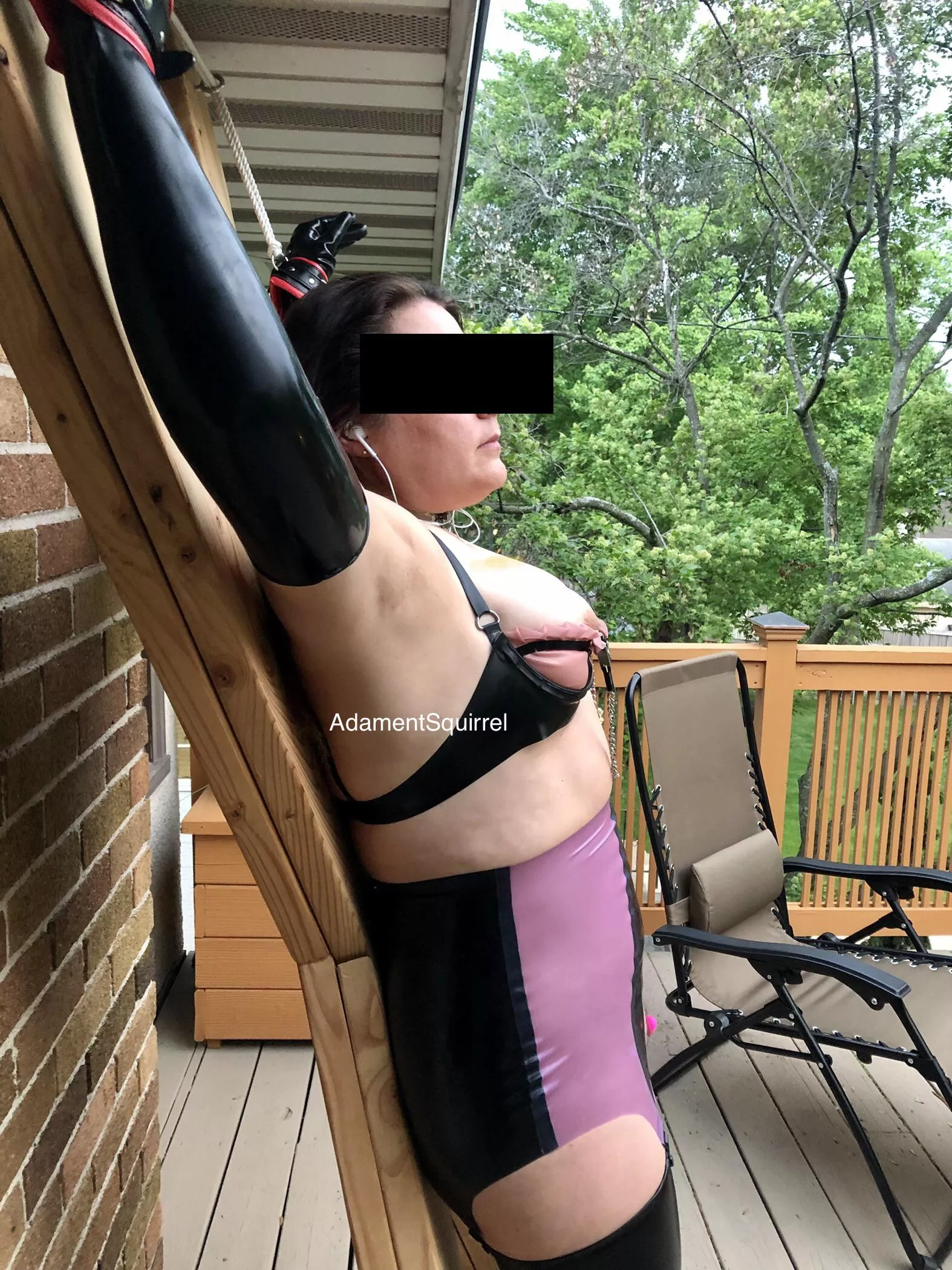 Tied to the cross in latex on the deck. Too bad my neighbors aren’t more observant! [F] OC