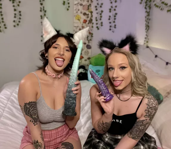 Two cat girls enjoying their toys 💜