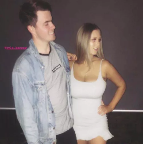 Who is this busty girl in white?