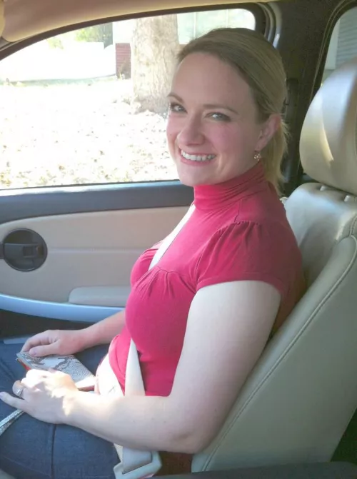 wife in the car showing her ring